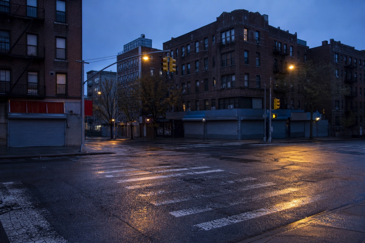 AI editorial reconstruction of an empty Bronx intersection at blue hour
